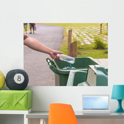 Hand throwing bottle in trash cans Wall Decal