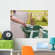 Hand throwing bottle in trash cans Wall Decal