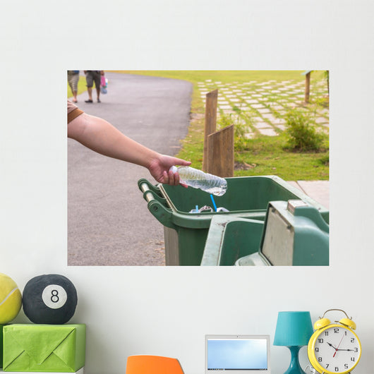 Hand throwing bottle in trash cans Wall Decal