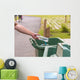Hand throwing bottle in trash cans Wall Decal