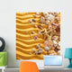 Yellow sand and seashells background. Wall Decal