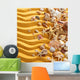 Yellow sand and seashells background. Wall Decal