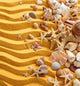 Yellow sand and seashells background. Wall Decal