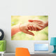 Old and young holding hands on light background, closeup Wall Decal