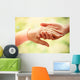 Old and young holding hands on light background, closeup Wall Decal