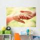Old and young holding hands on light background, closeup Wall Decal