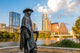 Stevie Ray Vaughan statue in front of downtown Austin and the Co Wall Decal