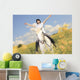 A white horse on yellow flower field with a rider. Wall Decal