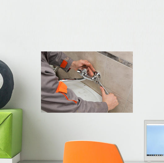 Plumber hands fixing water  tap with spanner, faucet and tool Wall Decal