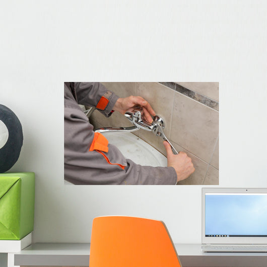 Plumber hands fixing water  tap with spanner, faucet and tool Wall Decal