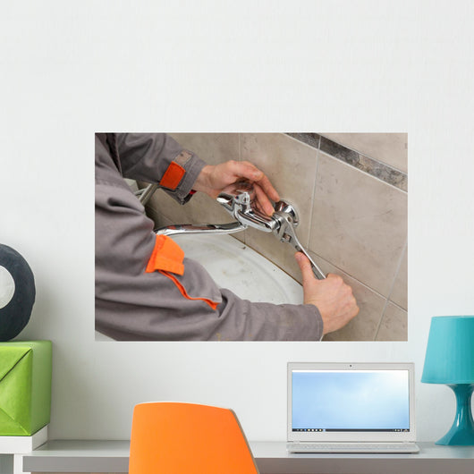 Plumber hands fixing water  tap with spanner, faucet and tool Wall Decal