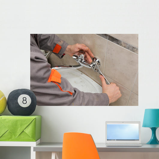 Plumber hands fixing water  tap with spanner, faucet and tool Wall Decal