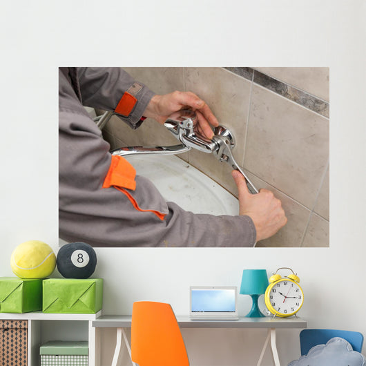 Plumber hands fixing water  tap with spanner, faucet and tool Wall Decal