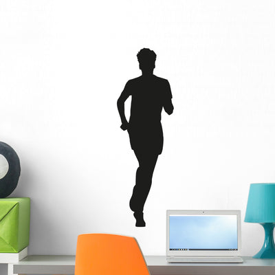 Young Running Man Wall Decal shown on a wall