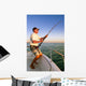 Angler fisherman fighting big fish on the ocean from the boat Wall Decal