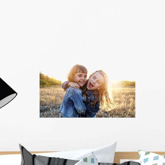 Two young girls have fun outside Wall Decal