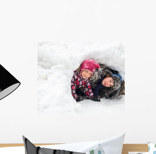 Children playing in a snow cave Wall Decal