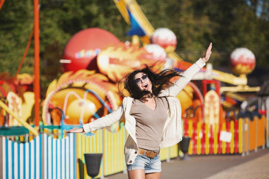Amusement Park Rides. A Young Woman Is Happy And Jumps. Wall Decal