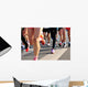 marathon runner legs running on city street Wall Mural