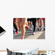 marathon runner legs running on city street Wall Mural