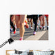 marathon runner legs running on city street Wall Mural