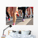 marathon runner legs running on city street Wall Mural