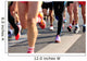 marathon runner legs running on city street Wall Mural