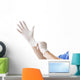 Doctor putting on sterile gloves Wall Decal