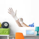 Doctor putting on sterile gloves Wall Decal
