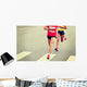 marathon runner legs running on city street Wall Mural