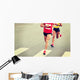marathon runner legs running on city street Wall Mural