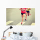 marathon runner legs running on city street Wall Mural