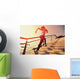 young fitness woman running on seaside stone stairs Wall Mural