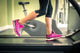 Fitness Girl Running On Treadmill. With Muscular Legs In Gym. Wall Decal
