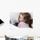Sleeping child with toys Wall Mural