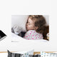 Sleeping child with toys Wall Mural
