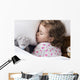 Sleeping child with toys Wall Mural