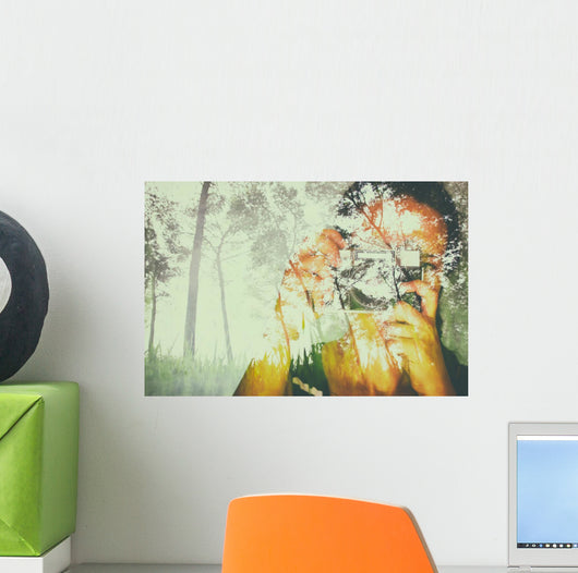 double exposure image of young girl holding old camera and natur Wall Mural