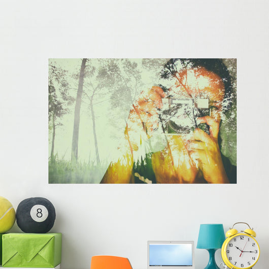 double exposure image of young girl holding old camera and natur Wall Mural