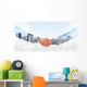 Hansshake of two businessmen on a city background Wall Mural