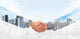 Handshake Of Two Businessmen On A City Background Wall Decal