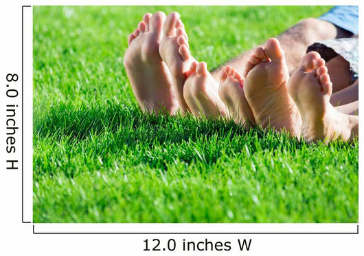 Family relaxing on the grass Wall Mural