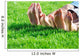 Family relaxing on the grass Wall Mural