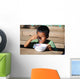 Child eating Wall Mural