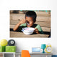 Child eating Wall Mural