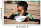 Child eating Wall Mural