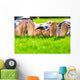 Family relaxing on the grass Wall Mural