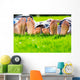 Family relaxing on the grass Wall Mural