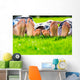 Family relaxing on the grass Wall Mural