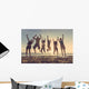Multiracial group of people jumping at beach Wall Mural